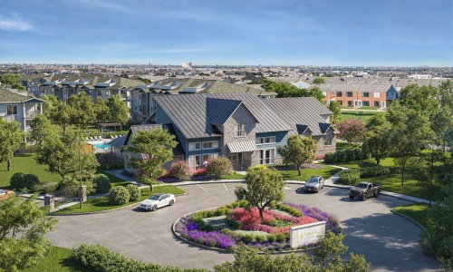 a building with trees and cars