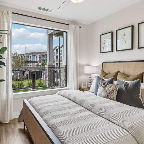 Bedroom with natural lighting and high ceilings