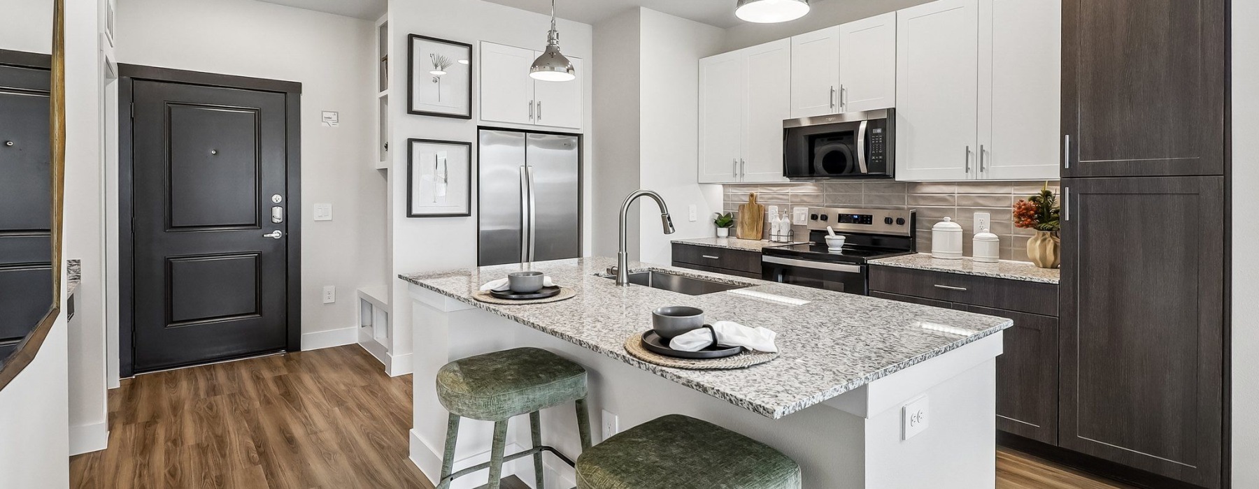 a kitchen with white cabinets