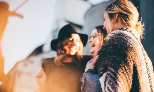 three women laughing